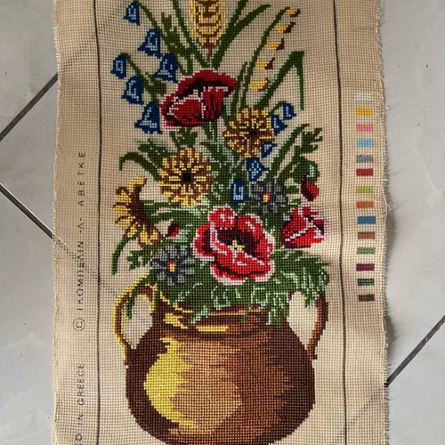 Handmade embroidery artwork with wildflowers in copper pot like new
