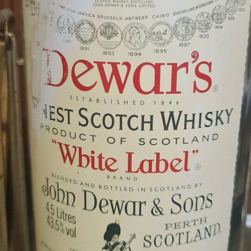 Dewar's White Label whisky used large 4.5L bottle with metal cradle vintage