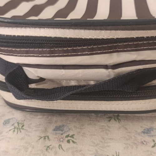 Insulated backpack with bottle holder like new, black and white striped