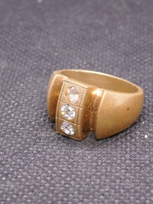Brass ring with 3 zircon stones