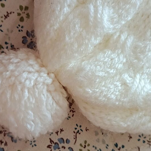 Children's knitted hat with pom pom, like new, white