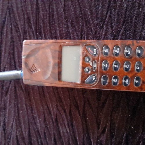 Ericsson antique phone used with wood-style finish