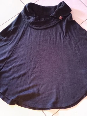 Black poncho like new, one size with details on sleeves and neck