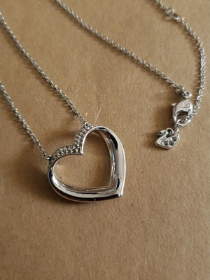 Swarovski silver heart-shaped pendant like new