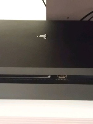 PlayStation 4 Slim 1TB console with 3 controllers and 6 games