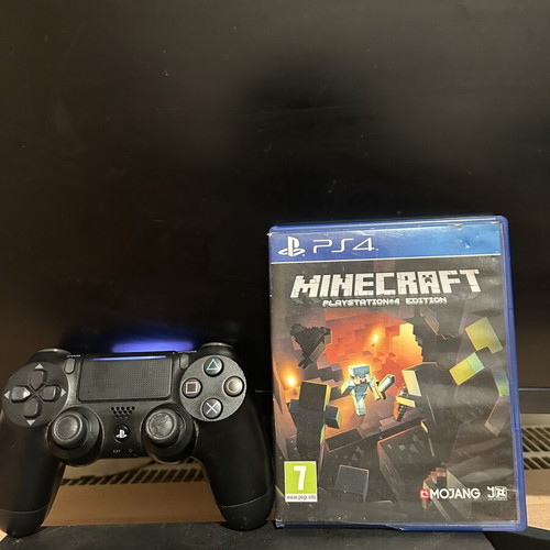 PlayStation 4 console with controller and Minecraft game, 500GB