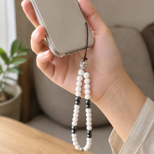 Handmade mobile wrist strap with white mineral glass and hematite ZP-005
