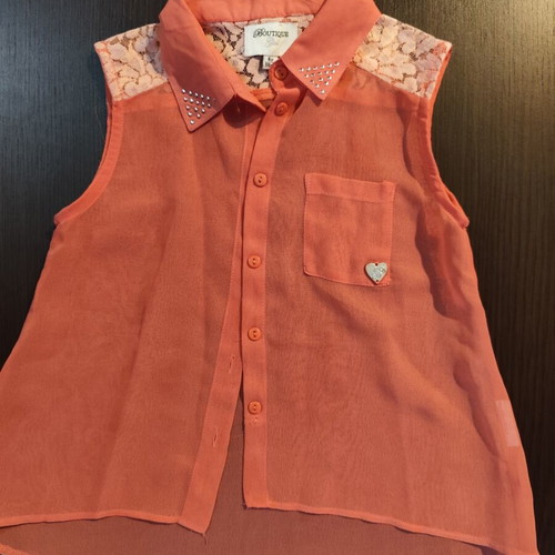 Sleeveless coral blouse with lace and studs, like new, size 6 years