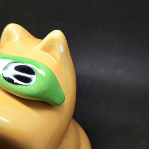 Ceramic dog piggy bank used, orange with sunglasses