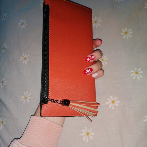 Orange wallet with six card slots and two bill compartments