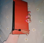 Orange wallet with six card slots and two bill compartments