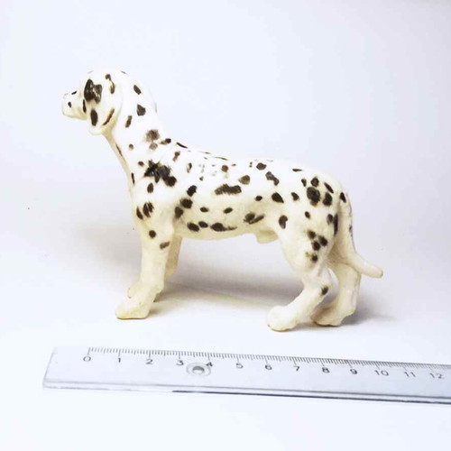 Plastic dog figure used with marks and scratches