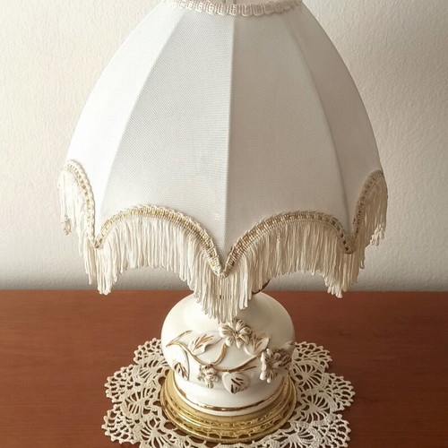 Vintage porcelain table lamp with fabric white shade and fringes used