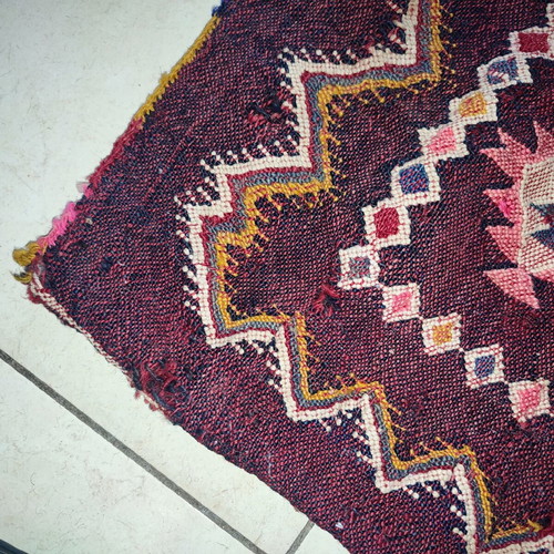 Old woven double horse saddle bag used with fabric tears