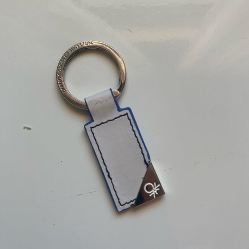 Benetton keychain like new, white and blue