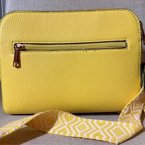 Yellow shoulder bag like new with strap and silver details