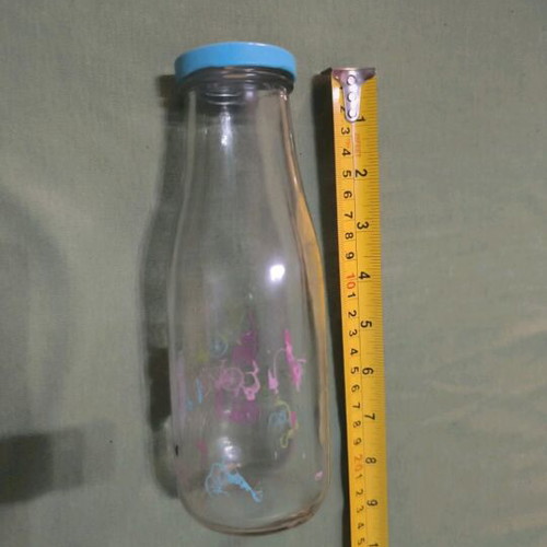 Glass water bottle used with hole for straw