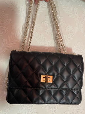 Small shoulder bag new, black with gold details