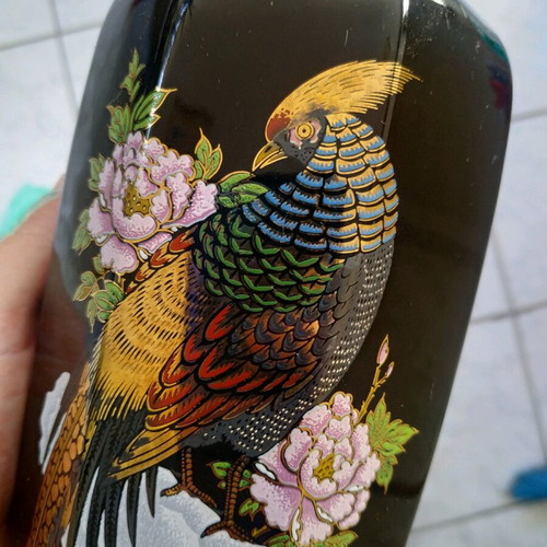 Black vase with golden embossed paintings