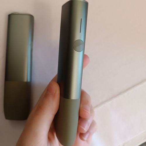 Iqos devices used, pack of two green with charger and brush