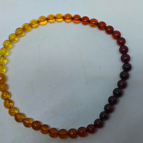 Handmade bracelet from natural amber with color gradient like new