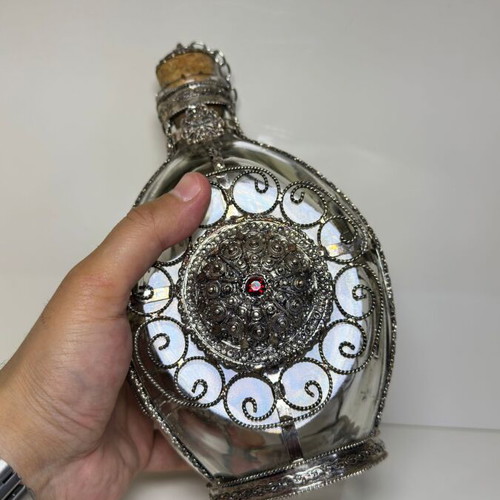 Vintage ornate handmade filigree glass bottle with red stones