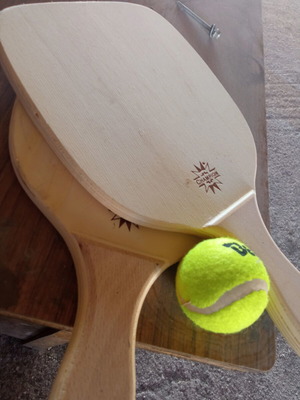 Wooden rackets with ball used, minor imperfections