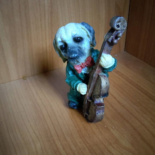 Decorative dog figure with cello like new