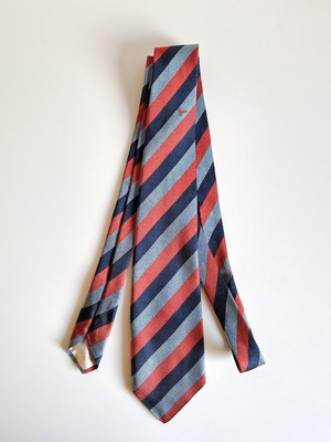 Yves Saint Laurent tie used, 100% silk diagonal stripes with embroidered bird