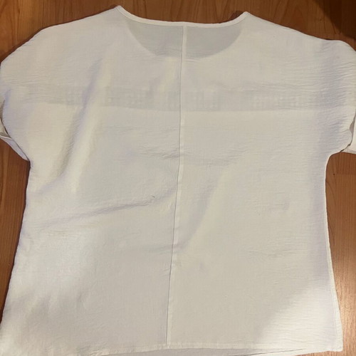 Blouse XL used, light beige with embossed chest design and cuff revers