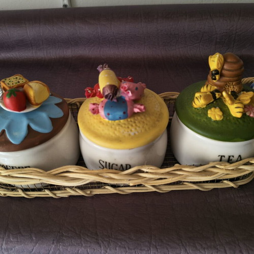 Set of 3 ceramic kitchen jars with handmade lids and wicker basket
