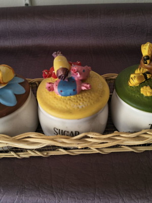 Set of 3 ceramic kitchen jars with handmade lids and wicker basket