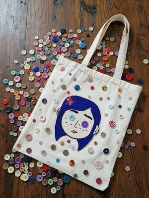 Handmade cotton shoulder bag with embroidered Coraline face and buttons beige