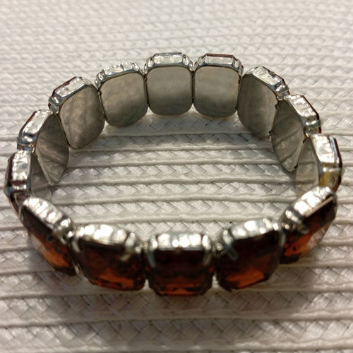 Women's bracelet with large polyhedral inserts, like new, cognac shade