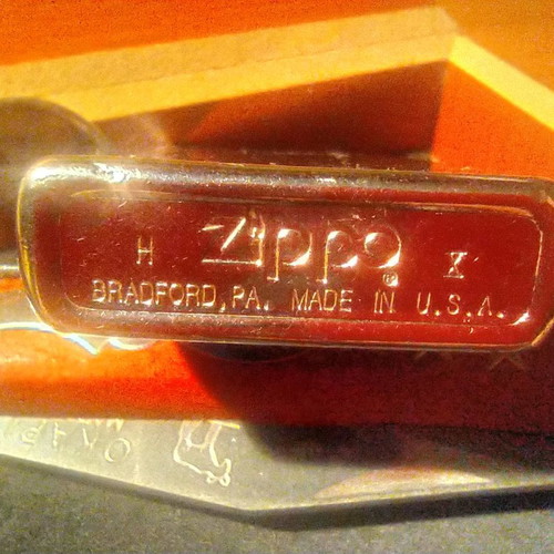 Collectible Zippo lighter 32 years old and handmade Okapi knife.