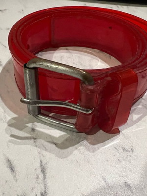 Red transparent plastic belt used, size 70