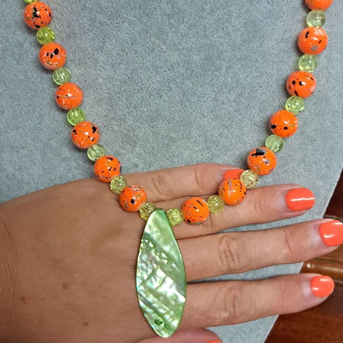 Long necklace with shell pendant, orange and green beads