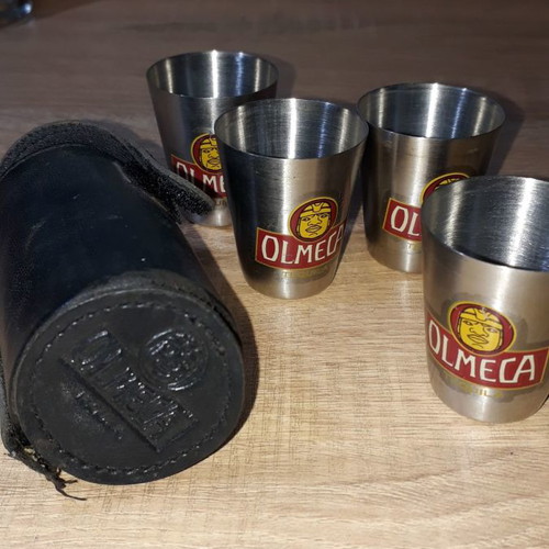 Olmeca leather case and four used shot glasses