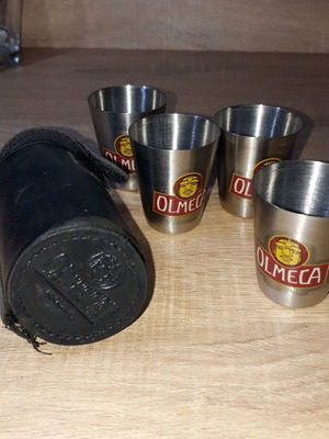 Olmeca leather case and four used shot glasses