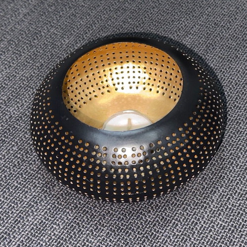 Metal tealight candle holder used black-gold with perforated design