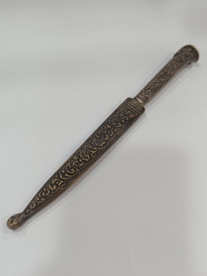 Vintage letter opener with metal case, embossed decorative design