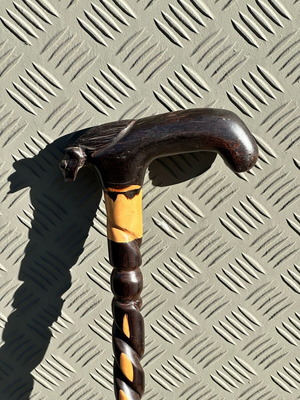 Handmade wooden walking stick used with lion head and spiral decoration