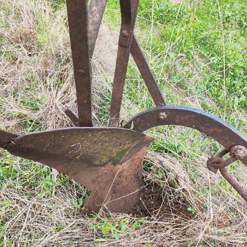 Antique plow used for garden decoration