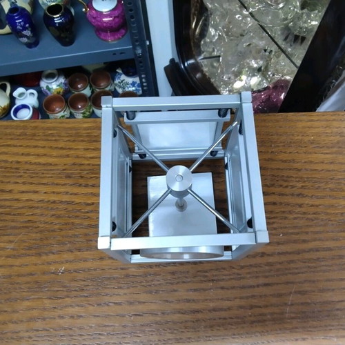 Quartz table clock silver color rotating, like new