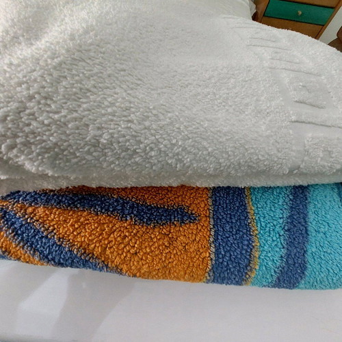 Beach and bath towels like new, 2 large, white and printed