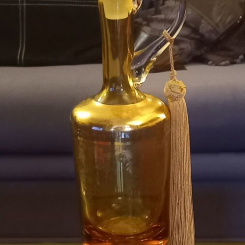 Vintage decorative glass jug with gold decoration and tassel