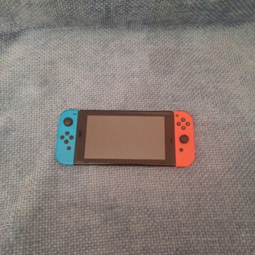 Nintendo Switch console with controller, Mario Kart Deluxe 8 code