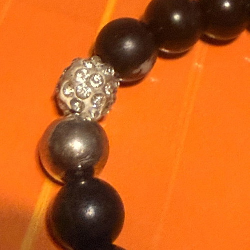 Elastic bracelet like new with steering wheel and turtle charms black-silver
