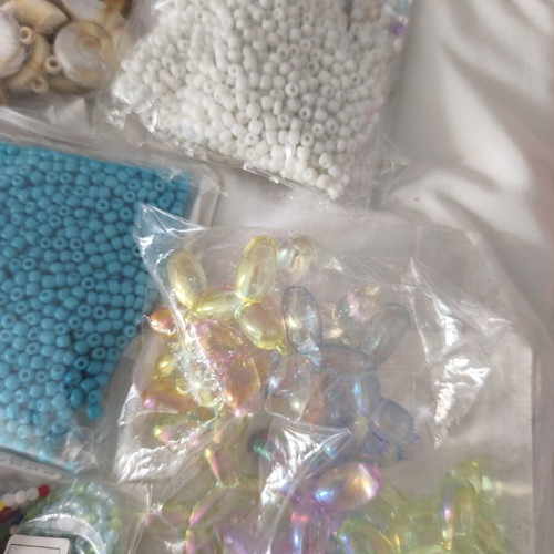 Jewelry making materials like new, shell chips, plastic and resin beads