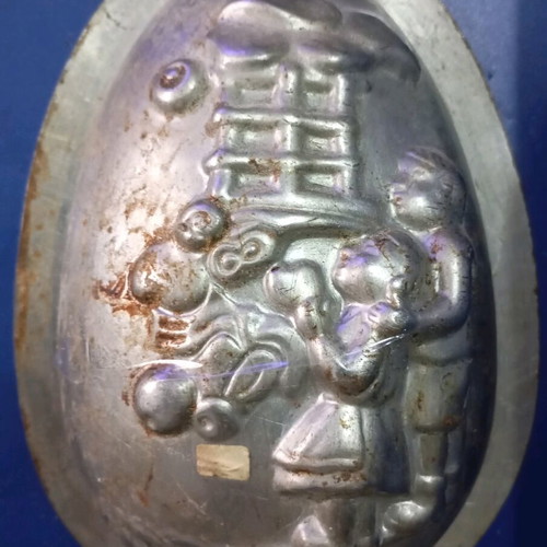 Easter mold used for chocolate egg with children and gifts design